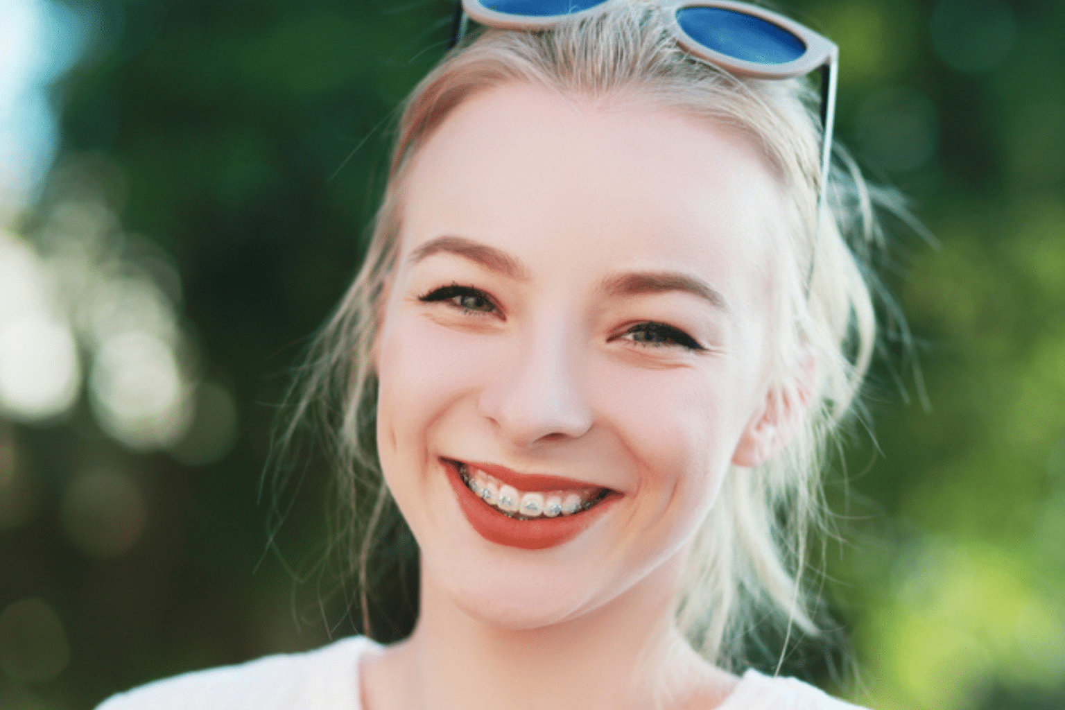 College student smiling with braces