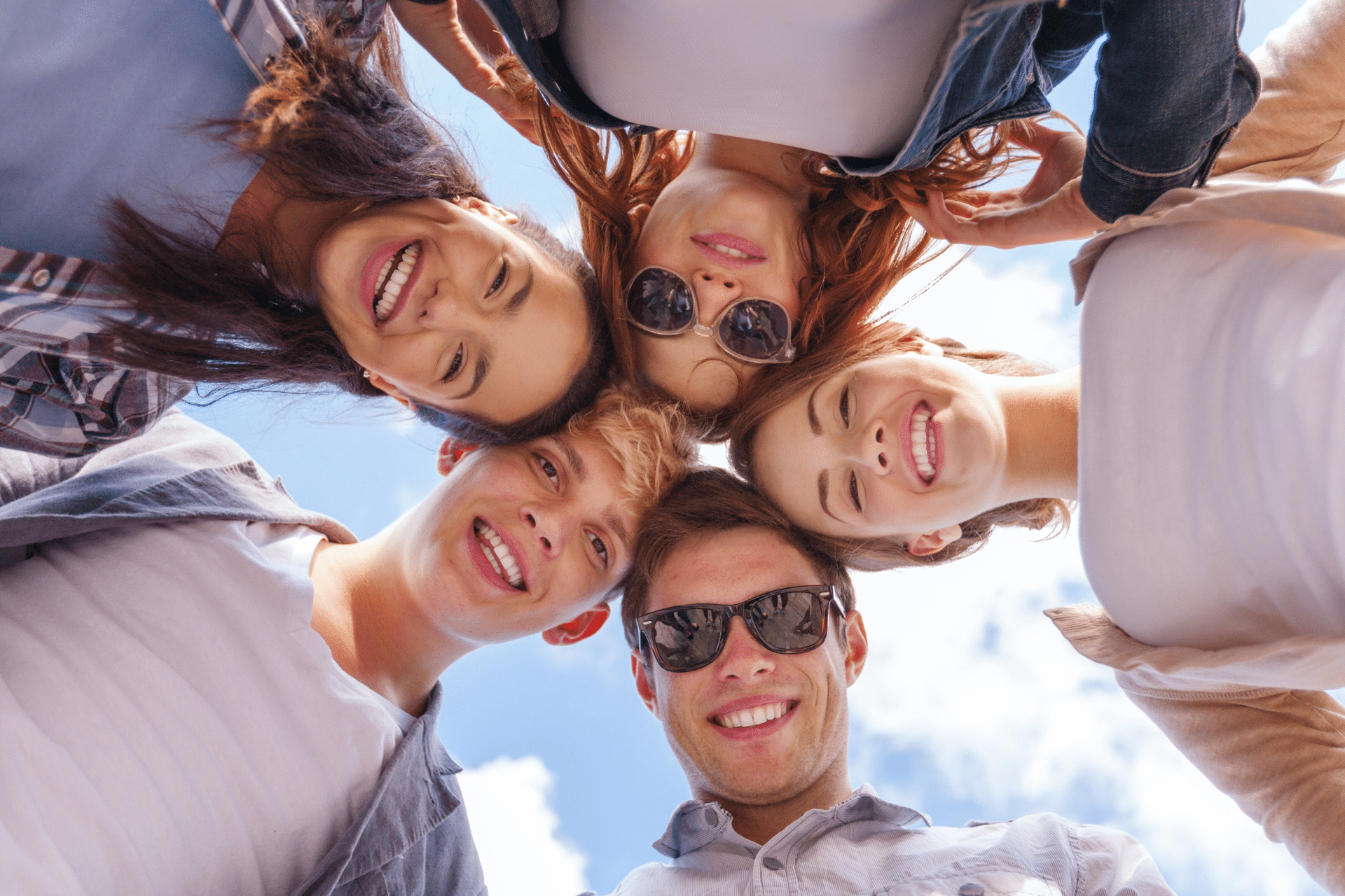 Low-angle view of friends with straight teeth
